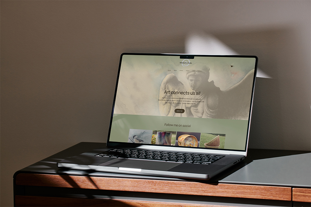 Laptop open to 5 Elements Studio website