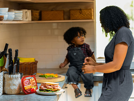 Mother preparing a meal with her child